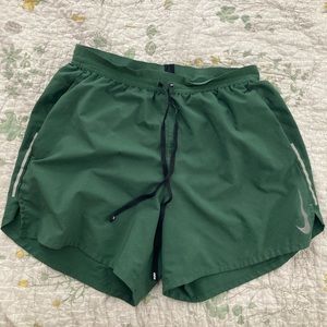 Green Nike running shorts